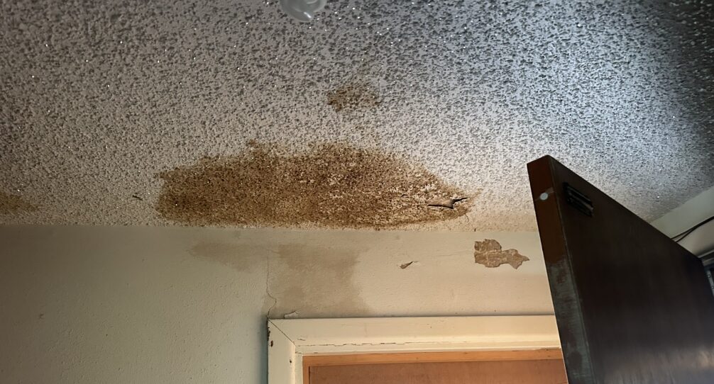 water stained ceiling from leaking roof inside home Dolan Roofing & Construction In San Antonio, TX